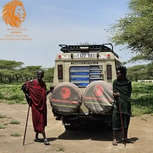 Masai people gathered near Tanzania Safari Experts car in a Maasai village, Ngorongoro