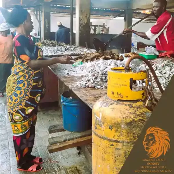 Fish market activity in Dar es Salaam with locals preparing and selling fish